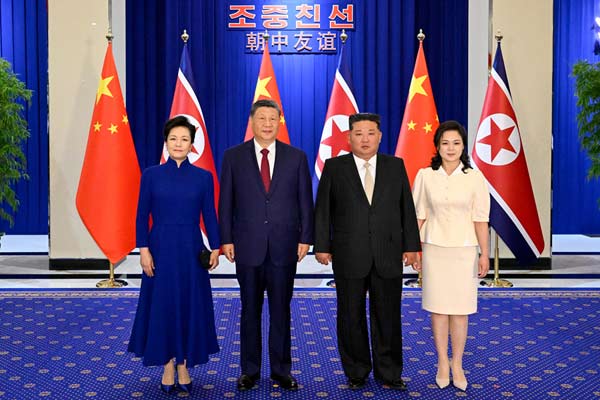习近平出席金正恩举行的